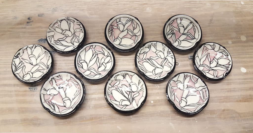 Magnolia Dishes. Porcelain, fired to cone 6 in oxidation. 2018. By Nikki Navaille.